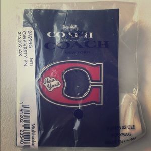COACH red NY pin.
